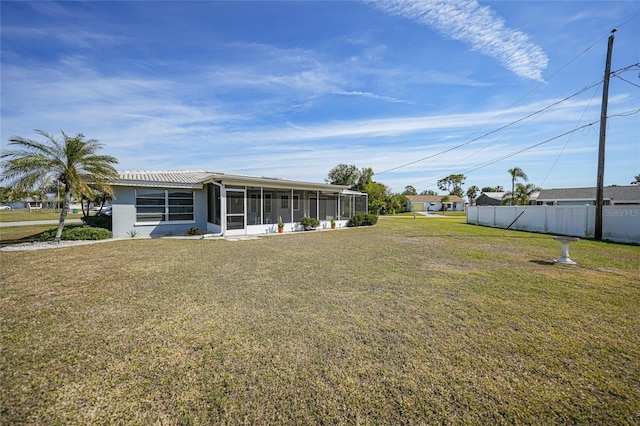 view of yard with a sunroom