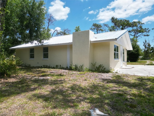 view of home's exterior featuring a yard