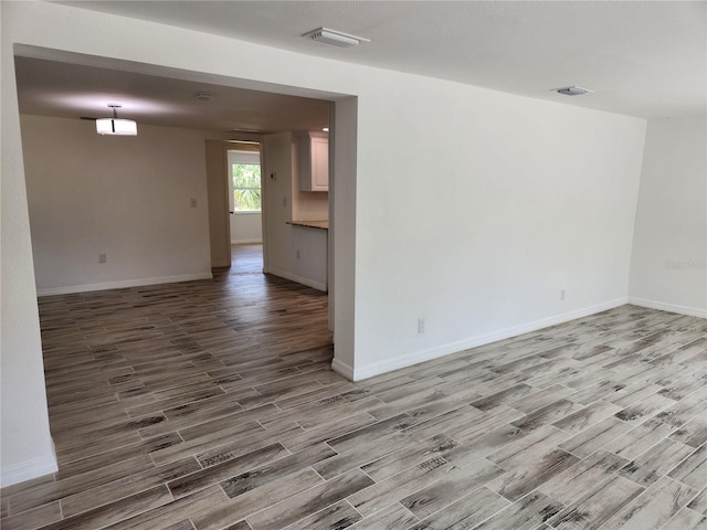 unfurnished room featuring wood-type flooring