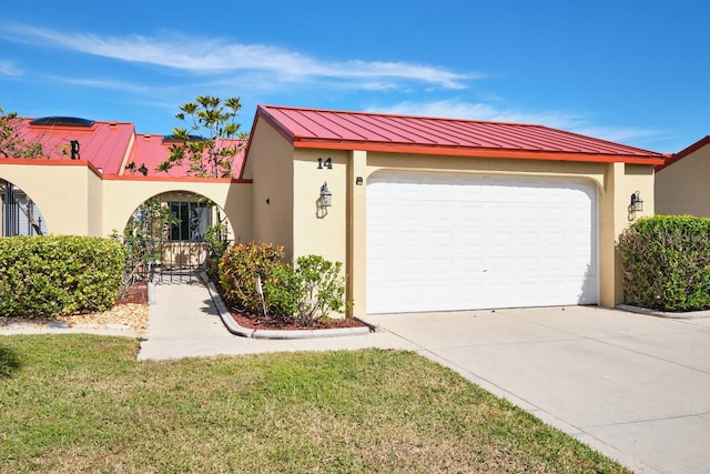 view of front of property with a garage and a front yard