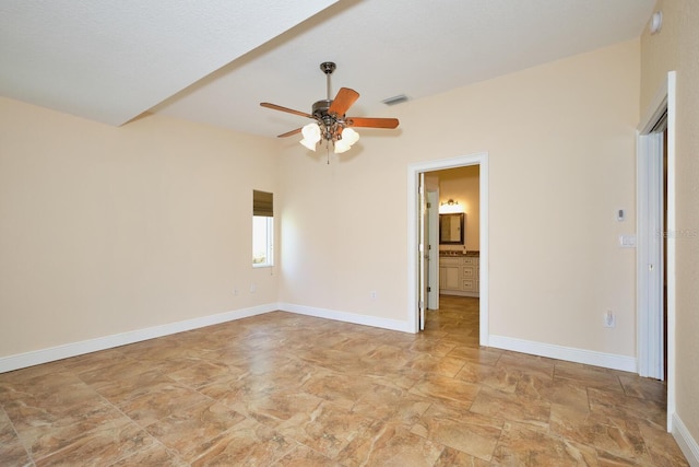 spare room with ceiling fan