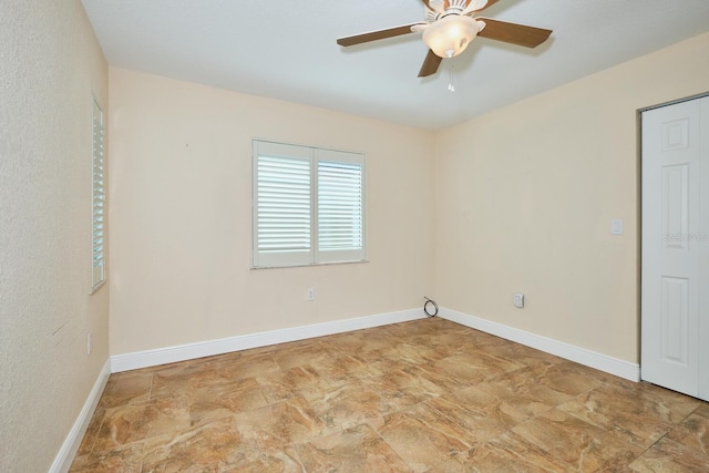 spare room featuring ceiling fan