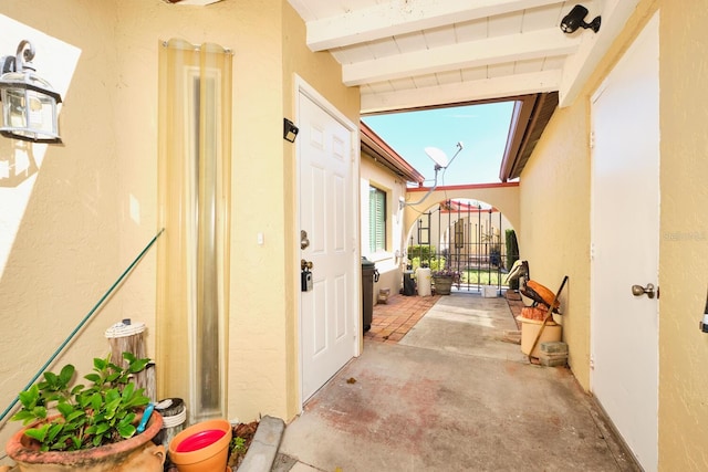 entrance to property featuring a patio area