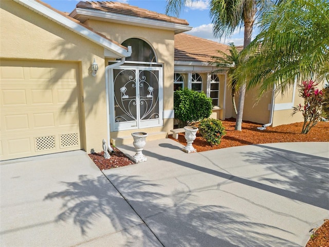 view of exterior entry featuring a garage