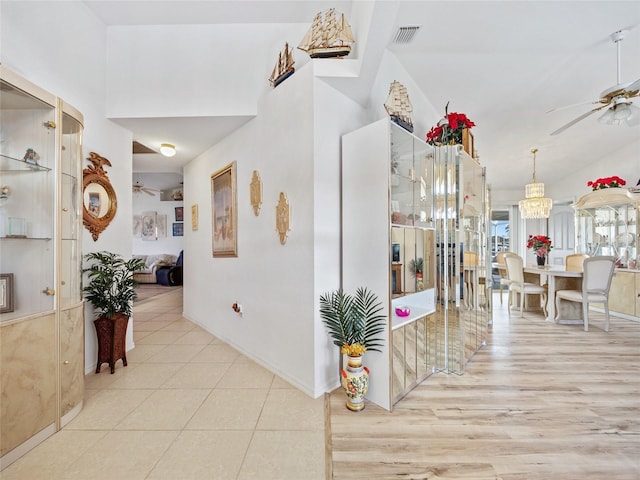 hallway featuring light tile patterned floors