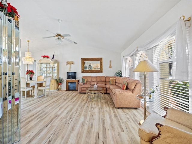 living room with lofted ceiling, light hardwood / wood-style floors, and ceiling fan