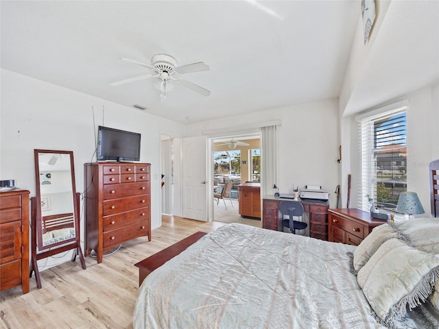 bedroom with light hardwood / wood-style floors and ceiling fan