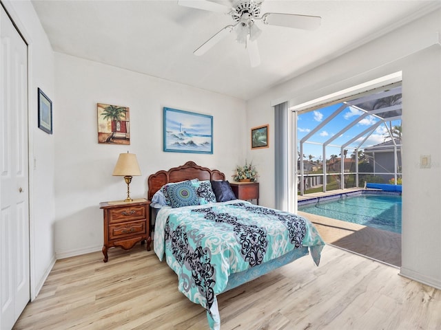 bedroom featuring ceiling fan, access to exterior, light hardwood / wood-style floors, and a closet