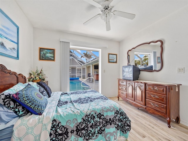 bedroom with light hardwood / wood-style flooring, ceiling fan, and access to outside