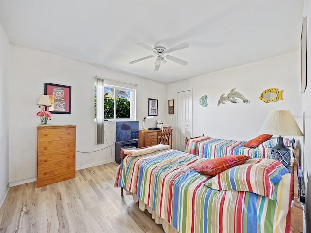 bedroom with ceiling fan and light wood-type flooring