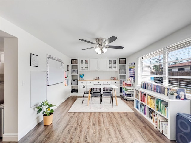 dining room featuring ceiling fan and light hardwood / wood-style floors