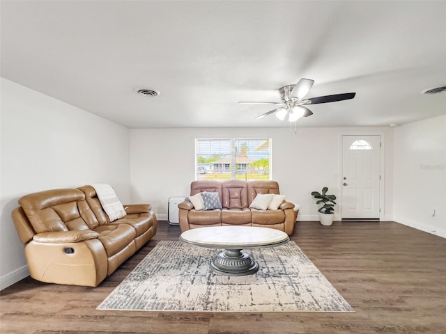 living room featuring hardwood / wood-style flooring and ceiling fan