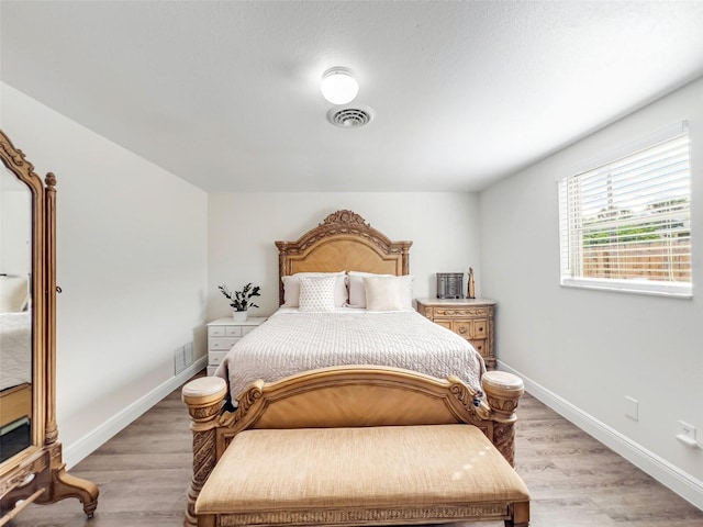 bedroom with light wood-type flooring