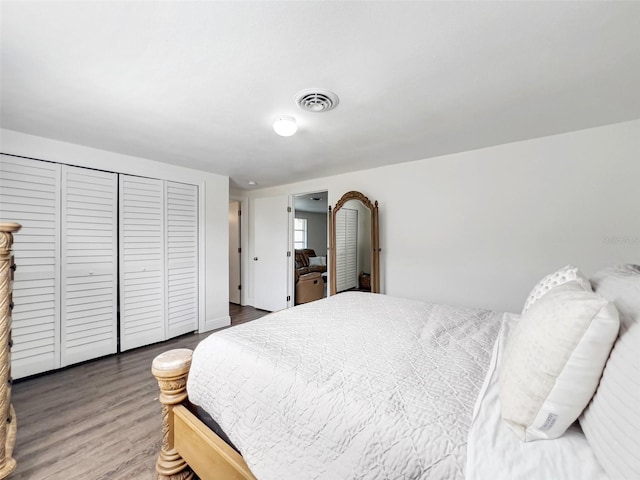 bedroom with hardwood / wood-style flooring and a closet