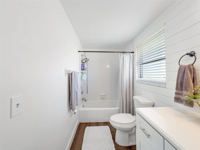 full bathroom with vanity, toilet, hardwood / wood-style floors, and shower / bath combo