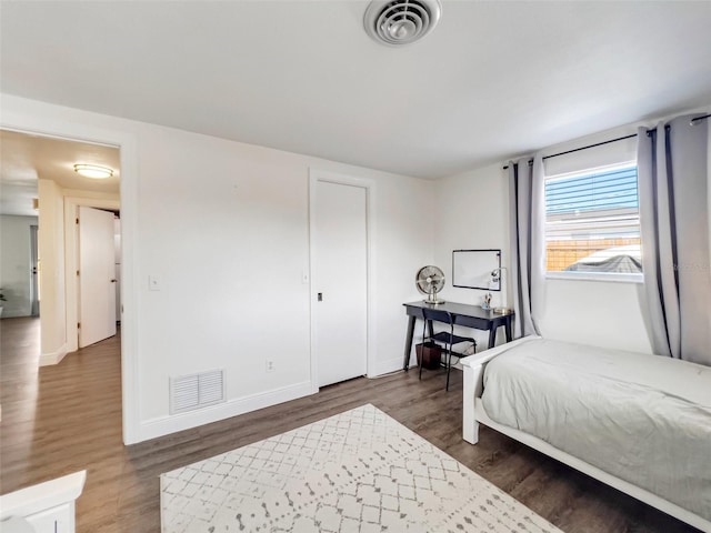 bedroom featuring dark wood-type flooring