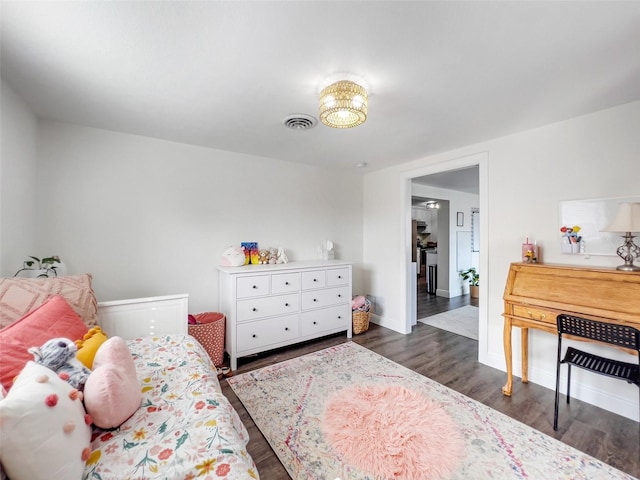 bedroom featuring dark hardwood / wood-style flooring