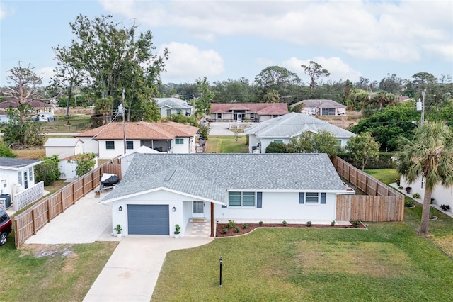 view of front of property with a garage and a front yard