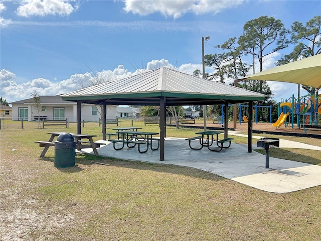 surrounding community featuring a gazebo, a lawn, and a playground