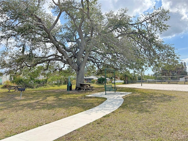 view of community featuring a yard and volleyball court