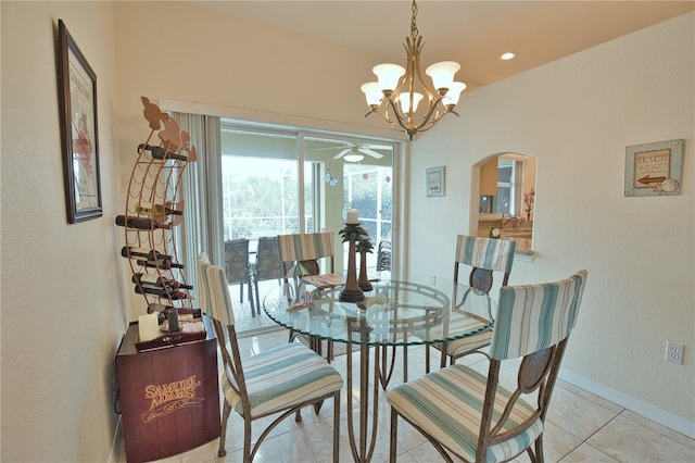 dining room featuring light tile patterned floors and a chandelier