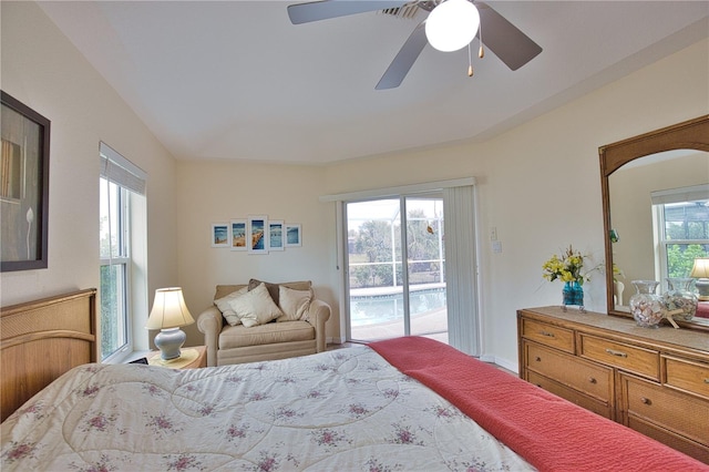 bedroom with ceiling fan and access to exterior