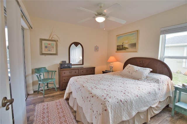 bedroom with hardwood / wood-style floors and ceiling fan