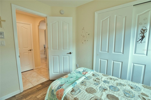 bedroom with wood-type flooring