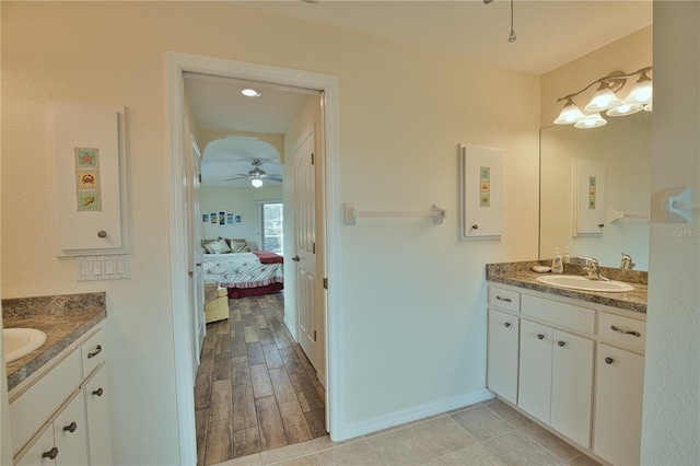 bathroom with vanity, wood-type flooring, and ceiling fan