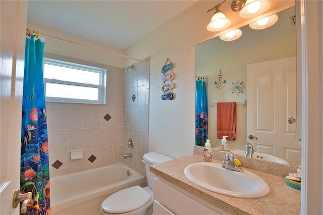 full bathroom featuring vanity, shower / bath combo, and toilet