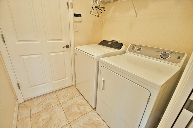 laundry area featuring separate washer and dryer