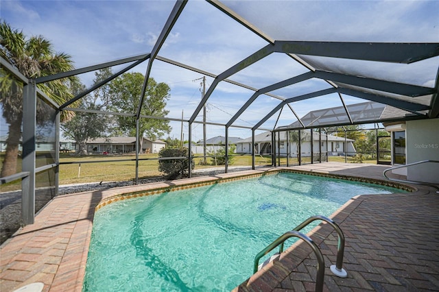 view of pool featuring a lanai and a patio