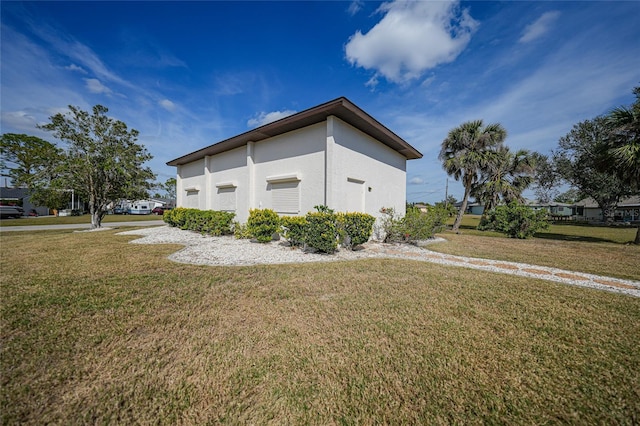 view of property exterior featuring a lawn