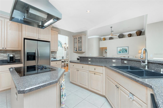 kitchen featuring sink, a center island, stainless steel refrigerator with ice dispenser, extractor fan, and black electric cooktop