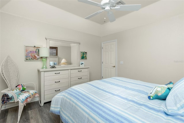 bedroom with dark wood-type flooring and ceiling fan