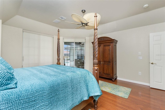 bedroom with ceiling fan, dark hardwood / wood-style flooring, and access to exterior