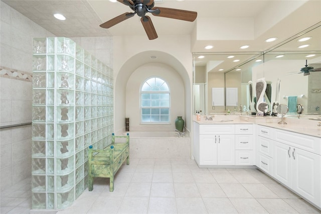 bathroom with ceiling fan, vanity, shower with separate bathtub, and tile patterned flooring