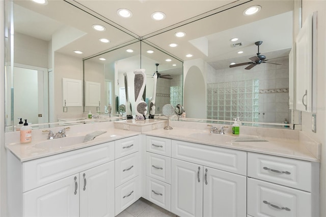 bathroom with vanity, a tile shower, tile patterned floors, and ceiling fan