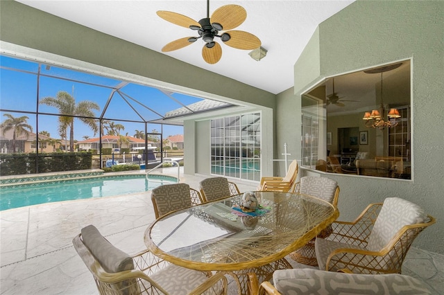 view of pool with a lanai, ceiling fan, and a patio area