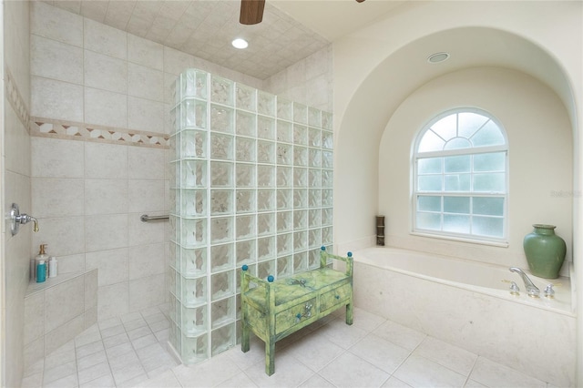 bathroom with plus walk in shower, tile patterned floors, and ceiling fan