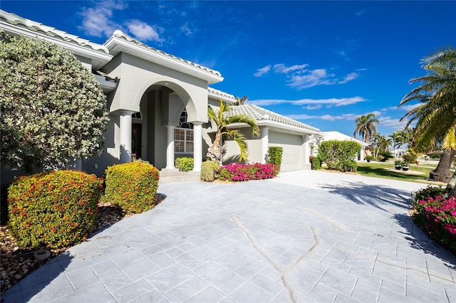 view of side of home with a garage