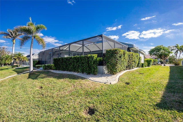 view of yard featuring glass enclosure