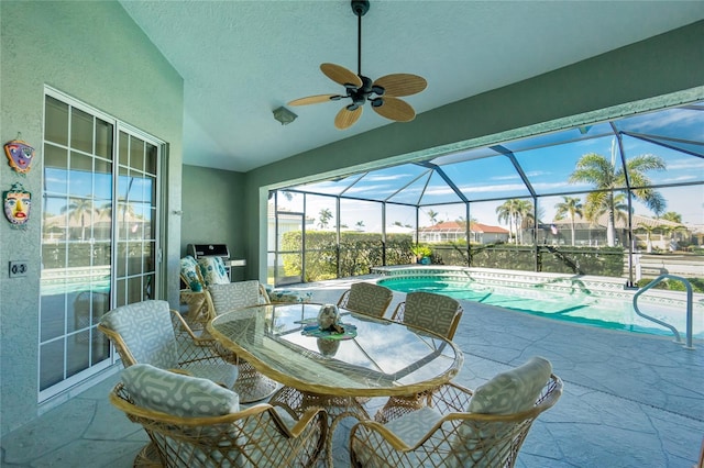 view of swimming pool with a patio, a lanai, and grilling area