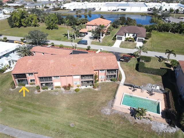 birds eye view of property with a water view