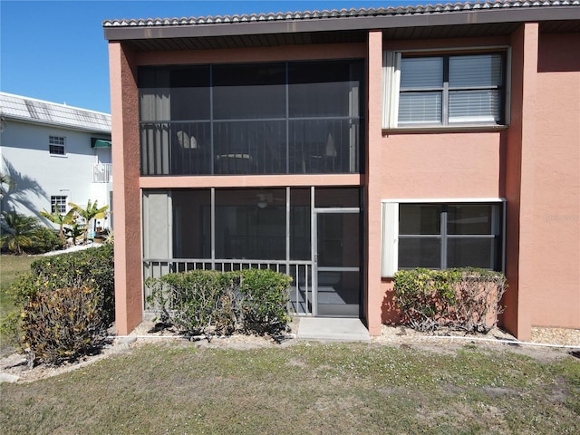 rear view of house with a lawn