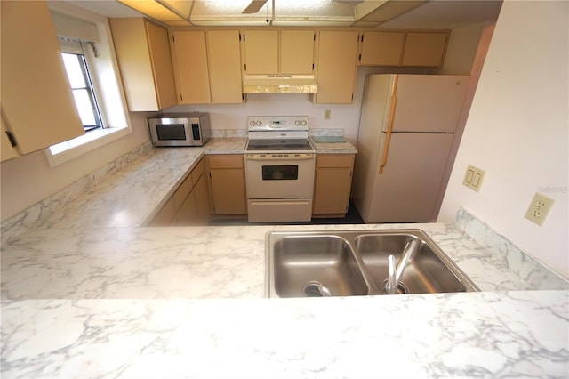 kitchen featuring white appliances and sink