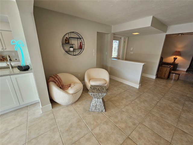 sitting room with light tile patterned flooring