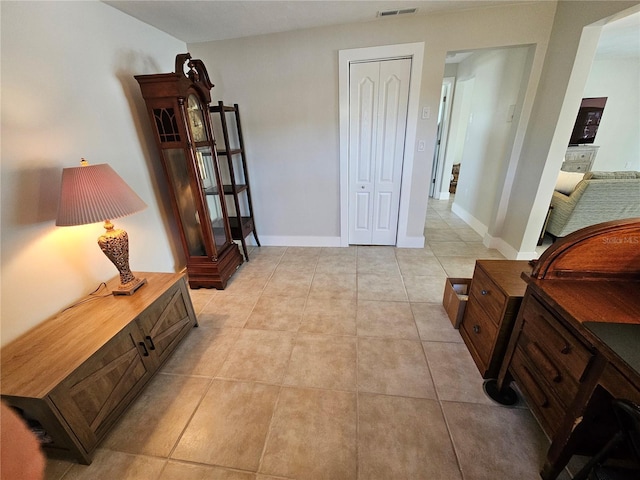 corridor featuring light tile patterned floors