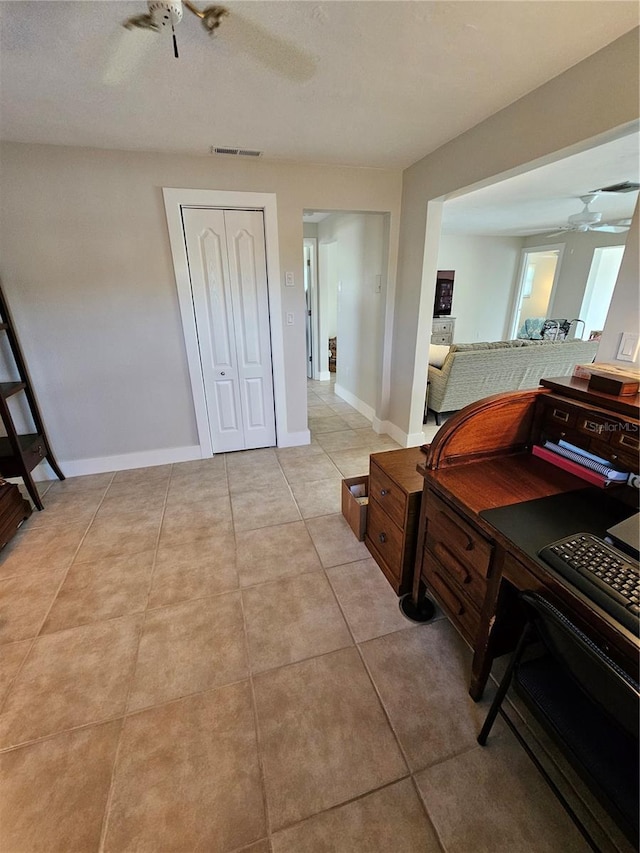 interior space with a closet and ceiling fan