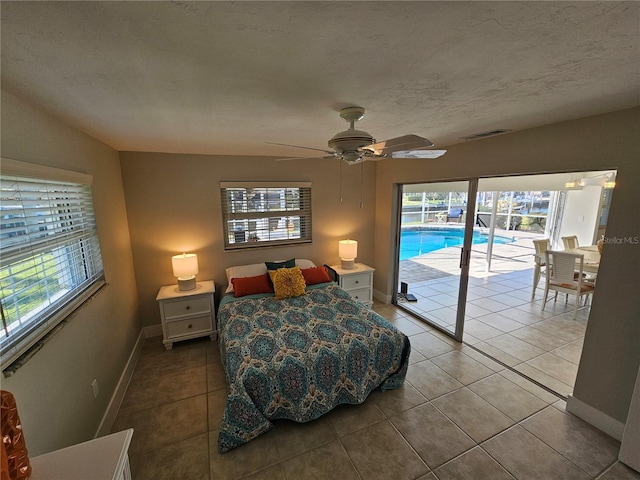 tiled bedroom with a textured ceiling, access to outside, and ceiling fan